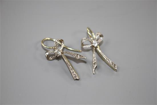 A pair of 20th century yellow metal and diamond set ribbon bow drop earrings, bow 22mm, gross weight 3.8 grams.